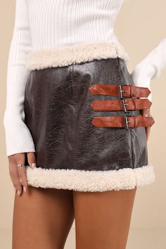 Give a little edge to your cold-weather wardrobe with the Lulus Flirty in Fall Dark Brown Vegan Leather Faux Fur Mini Skirt! This trend-setting skirt features a faux leather construction (with a distressed-like crinkle texture) as it shapes a coveted mid-rise fit. A trio of contrasting, light brown adjustable straps with gunmetal buckles adorn the side of the figure-skimming silhouette. White faux shearling trim accents the waist and the micro mini hem for an extra-cozy effect. Hidden side zippe Fur Mini Skirt, Fur Skirt, Micro Mini Skirt, Micro Mini, Fur Trim, Cold Weather, Light Brown, Vegan Leather, Dark Brown