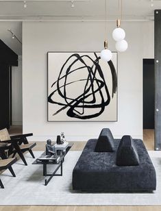 a modern living room with black and white decor