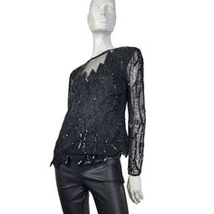 "Black Silk blouse by Stenay with black sequin and beading. Tagged Medium. 18\" across  22\" long  22\" sleeves  Sheer sleeves  Back zipper  * Good preowned vintage condition with no major flaws to note. Usual wear is consistent with age. Sold as is. * FINAL PRICE as listed. No discounts. *ALL SALES FINAL. NO RETURNS or exchanges.  * Please review all pictures as they are part of the listing. Ask questions! * Please review all shop policies before completing transaction.  * Bundle up for combine Black Sequined Blouse Piece In Georgette, Black Embellished Party Blouse, Black Sequined Georgette Blouse Piece, Luxury Black Blouse With Sequins, Fitted Vintage Sequin Blouse, Black Silk Blouse, Sequined Top, Sequin Top, Sheer Sleeves