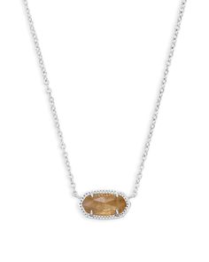 A dainty stone and delicate metallic chain combine to create the Elisa Silver Pendant Necklace in Citrine, your new favorite wear-anywhere accessory (and our November birthstone!). This pendant necklace can be paired with any look, providing that extra touch of timeless style. Make the Elisa Pendant Necklace a staple in your wardrobe and you will not be disappointed. • Rhodium Plated Over Brass • Size: 0.63"L x 0.38"W stationary pendant, 15" chain with 2" extender • Lobster claw closure • Materi Elisa Necklace, Elisa Pendant Necklace, Kendra Scott Necklace Elisa, Orange Citrine, Short Pendant Necklace, Kendra Scott Elisa, Kendra Scott Necklace, Citrine Necklace, Citrine Stone