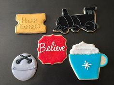 some cookies are decorated like trains and drinks