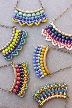 four pieces of beaded jewelry on a table