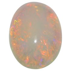 an opalite is shown against a white background with orange and yellow highlights in the center