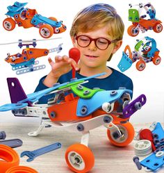 a young boy is playing with his toy airplane