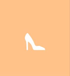 a pair of high heeled shoes on an orange background