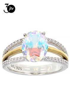 Bella Luce�� aurora borealis and white diamond simulants 5.91ctw oval and round, rhodium and 18k yellow gold over sterling silver ring. Measures approximately 0.81" L x 0.38" W and is not sizable. Diamond equivalent weight is 3.58ctw. Diamond Simulant, Aurora Borealis, White Diamond, Sterling Silver Ring, Aurora, Silver Ring, Sterling Silver Rings, Cubic Zirconia, Silver Rings