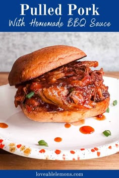 pulled pork sandwich with homemade bbq sauce on a white plate, with text overlay that reads pulled pork with homemade bbq sauce