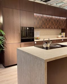 a kitchen with wooden cabinets and an island