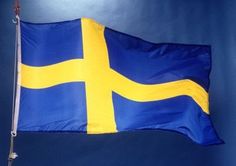 the flag of sweden is flying high in the sky