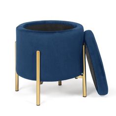 a blue chair with gold legs and a black seat cushion