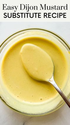 an easy dijon mustard recipe in a glass bowl with a spoon