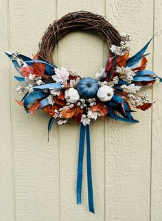 a wreath that is hanging on the side of a wall