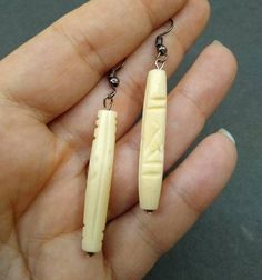 Carved bovine bone formed into a bead. It has a 925 plated silver french hook. If you would like to continue shopping for decorative bone items, wood paintings, and other rustic home décor, you may continue shopping by clicking this link, https://etsy.com/shop/CreativeWorkByAnnie White Carved Earrings For Gift, Bohemian Bone-colored Nickel-free Earrings, Traditional Bone-colored Jewelry Gift, Traditional Bone-colored Jewelry As A Gift, Elegant Handmade Bone-colored Jewelry, Bone Color Dangle Earrings With Ear Wire, Nickel-free Bone-colored Dangle Earrings, Nickel-free Bone Dangle Earrings, Nickel Free Bone Color Dangle Earrings