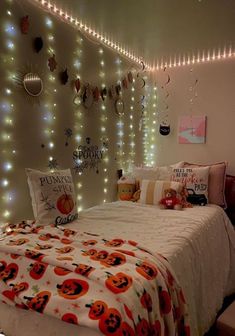 a bedroom decorated with halloween decorations and lights