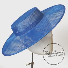 Boaters are all the rage, and this royal blue sinamay fascinator version has us all in a twirl! Made from 2 layers of stiffened sinamay, these boaters are ready to trim and have a petersham ribbon on it's inside edge. Simply add a comb or headband to secure to the head.Hat base measures:Width: 37cm (14.5 inches)Crown Width: Measures 15.5cm (6.1 inches) wide at base and 14cm (5.5 inches) at top Crown Height: 4.5cm (1.7 inches)Please note our latest batch of boaters have been made slightly bigger