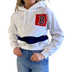 This Boston Red Sox cropped sweatshirt from Refried Apparel gives you the perfect layer to stand out on game day. The midweight fit and plush hood supply a warm and comfortable feel. Plus, this hoodie features a distinct Boston Red Sox design for an original look. Material: 50% Cotton/50% Polyester Screen print graphics Hooded Officially licensed Pullover Machine wash, tumble dry low Long sleeve Pullover Stitched fabric applique Midweight hoodie suitable for moderate temperatures Imported Fleece White Cotton Hoodie For Game Day, Team-colored Crew Neck Hoodie For Winter, Winter Hoodie In School Colors For School Spirit, Casual Team-colored Hooded Hoodie, Casual Cotton Hoodie For Sports Season, Team-colored Cotton Hoodie For Winter, Casual Team-colored Hoodie For Game Day, Casual Team-colored Cotton Sweatshirt, Winter Team-colored Cotton Hoodie