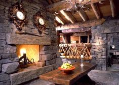 a living room with stone walls and fireplace