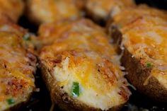 some food that is sitting on top of a grilling pan with broccoli and cheese