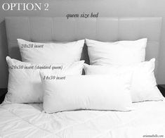 the bed has four pillows on it and two are labeled with measurements for each pillow