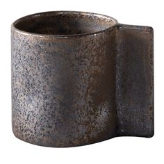 an old metal cup is shown on a white background