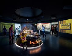 people are looking at a model of a city in a glass dome with the words franklin on it