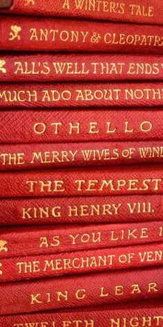 a stack of red books with gold writing on them