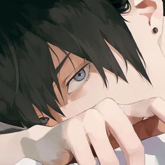 an anime character with black hair and blue eyes