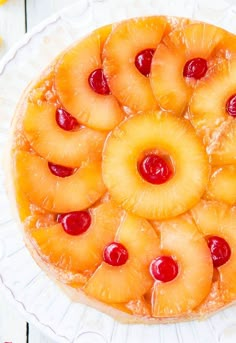 a pineapple upside down cake with cherries on top