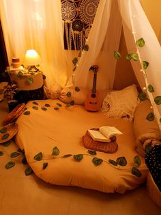 a bedroom with a bed covered in leaves and a guitar sitting on top of it