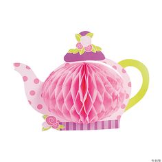 a pink teapot shaped paper decoration on a white background