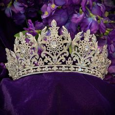 Majestic and glittering, this royal bridal crown designed for the regal bride. Encrusted with Swarovski crystals and cubic zirconium, Paris delivers endless glitter. -Genuine Crystal -AAA Cubic Zirconia -Comb added for comfort and security -Approx. 3 in (7.6 cm) wide x 12 in. (30.5 cm) long -Rhodium Plated. Brilliant non-tarnish silver finish Luxury Elegant Crown Design Headpieces, Luxury Teardrop Crown Headpiece With Crown Design, Crown Pics, Purple Butterfly Quinceanera Crown, Regal Bride, Luxury Elegant Crown-shaped Jewelry, Vintage Glam Fashion, Glamorous Crown-shaped Rhinestone Jewelry, Swarovski Tiara