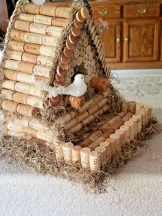 a bird house made out of wine corks