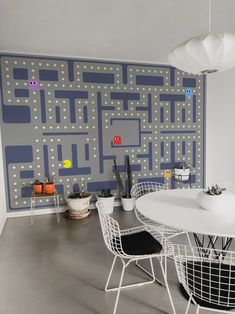 a white table and some chairs in a room