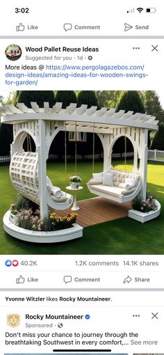 an outdoor swing set in the middle of a grassy area with white furniture and flowers