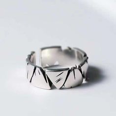 Elevate your style with this striking Geometric Silver Statement Ring. Crafted from high-quality silver, this ring features a bold, angular design that exudes modern elegance. The unique geometric pattern is both eye-catching and versatile, making it perfect for any occasion--whether you're dressing up for a special event or adding a touch of sophistication to your everyday look. This ring is designed to be adjustable, ensuring a comfortable fit for both men and women. Its minimalist aesthetic and sleek finish make it an ideal choice for those who appreciate contemporary jewelry with a distinctive edge. Key Features: Material: High-quality silver Design: Geometric angular pattern Finish: Sleek, polished silver Adjustable size: Perfect fit for any finger Unisex design: Suitable for both men Modern Irregular Metal Ring Jewelry, Trendy Irregular Silver Ring, Minimalist Irregular Metal Jewelry, Modern Irregular Metal Rings, Modern Irregular Shaped Metal Rings, Modern Adjustable Rings With Irregular Shape, Modern Adjustable Irregular Rings, Minimalist Silver Geometric Rings, Minimalist Geometric Silver Rings