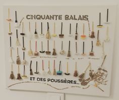 a white sign with many different types of brooms on it