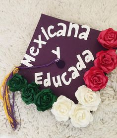 a purple cap with white and red flowers on it that says mexicana y educada