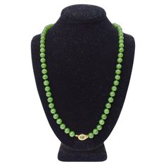 Add a beautiful jade beaded necklace to your jewelry collection! You will be in awe of the beauty of the vibrant green beads. This feature a fully beaded chain with a gold and jade pendant in the center. Pair this beautiful necklace with a Prada blouse, a Bottega Veneta handbag, and some Gucci jewelry to layer. Weight: 59.53 g Length: 12.5 inches Composition: Jade/ 14k Gold Plated on Silver Signed '925'