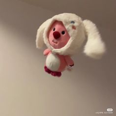 a small stuffed animal hanging from the ceiling