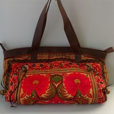 Embroidered Floral Bag With Real Leather Trim. Zipper Closure, Inside Pocket. Bell Accent On Sides. Floral Embroidery Throughout Both Sides. Gorgeous Colors! Brand New 18lx12hx3d Inches Traditional Orange Shoulder Bag For Travel, Traditional Yellow Shoulder Bag For Daily Use, Red Embroidered Travel Bag, Embroidered Brown Travel Bag, Embroidered Orange Bags For Daily Use, Vintage Embroidered Travel Satchel, Red Embroidered Bag For Daily Use, Traditional Yellow Bag For Everyday Use, Traditional Yellow Bags For Everyday Use