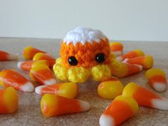 a close up of candy candies with an orange and white hat on top of them