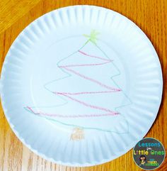 a paper plate with a christmas tree drawn on it