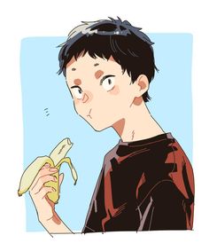 a boy holding a banana in his hand