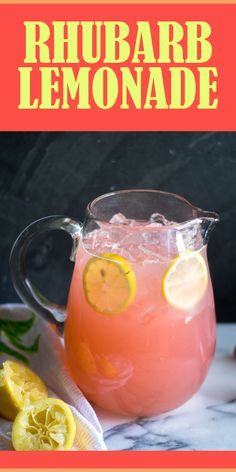 a pitcher filled with lemonade sitting on top of a table