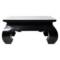 a black and white bench with two legs on it's end, sitting against a white background