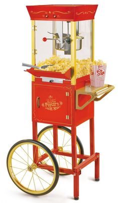 With a vintage look reminiscent of silent movie houses and carnivals of the 1900s, this cart is a classic addition to any home. Featuring a large 6-ounce kettle with built-in stirring system, this unit pops up to 32 cups of delicious popcorn every time. Tempered glass windows and door, along with interior light, lets everyone watch each delicious kernel pop to perfection. A convenient utility shelf is perfect for popcorn preparation. Plus, keep all your popcorn essentials on hand in the convenie Vintage Popcorn Machine, Coconut Oil Popcorn, Popcorn Oil, Kettle Popcorn, Popcorn Cart, Movie Theater Popcorn, Movie Night Popcorn, Best Popcorn, Popcorn Bowl