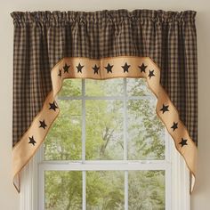 a window with stars on the valance and checkered curtains in front of it