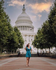 a woman standing in front of the capitol building