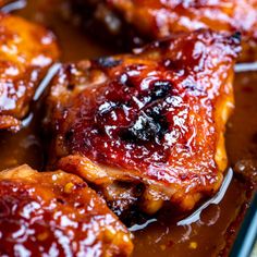 closeup of chicken wings covered in bbq sauce