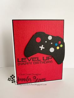 a card with a video game controller cut out on it's side and the words level up happy birthday